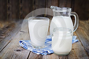 Glass of milk and jug photo