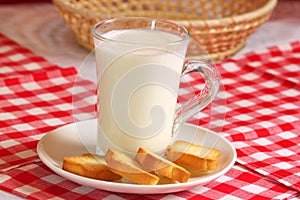 Glass of milk with rusks
