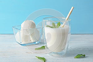 Glass with milk shake and tasty vanilla ice cream