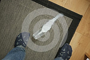 glass of milk spilled on gray color carpet