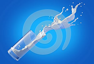 Glass of milk spilling in the air with big splash. Isolated On blue background