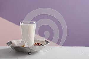 Glass of milk on vintage plate