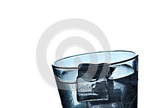 Glass of mineral carbonated water with ice.Closeup.Isolated