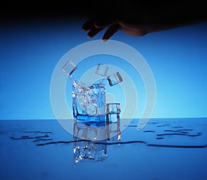 Glass of mineral clear water with ice