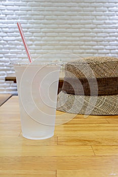 Glass of mineral water on wood table.