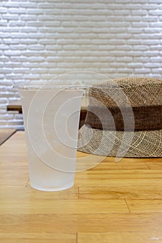 glass of mineral water on wood table.