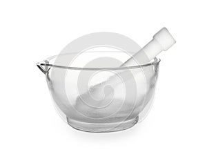 Glass mortar and pestle on white background