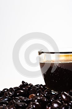 The glass mug of coffee and coffee bean photo