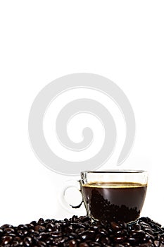 The glass mug of coffee and coffee bean photo