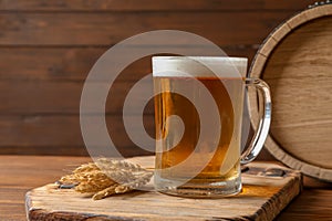 Glass mug with cold tasty beer and malt