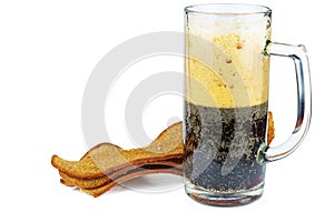 Glass mug with dark bear and roasted rye bread rusks