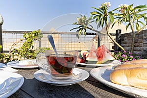 glass mug with tea on beautiful background of the main attractions of Egypt, the Great pyramids of Giza