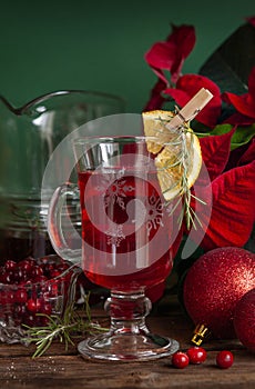 Glass mug of warming vitamin cranberry drink. Christmas and New Year home holidays concept