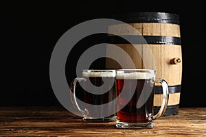 Glass mugs of delicious kvass and barrel