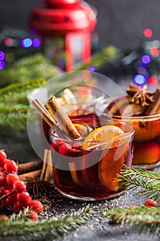 Glass mugs of mulled wine with spices and citrus fruits. Traditional hot drink or beverage, festive cocktail at X-mas or New Year