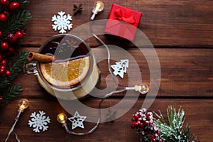 Glass of mulled wine on a festive table decorated for Christmas. Christmas or winter hot drinks. Top view, selective