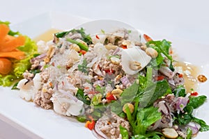 Glass noodle with pork, seafood, nut, vegetable is spicy food or Yum Woon Sen