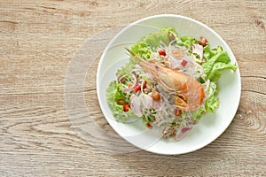 Glass noodle with shrimp and chop pork spicy salad on plate