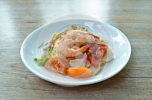 Glass noodle with shrimp and minced pork spicy salad on plate