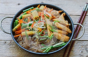 Glass noodles with chicken, green beans, carrots, corn, soya sprouts and greens