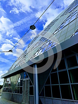 Glass Office building with blue cloudy skys