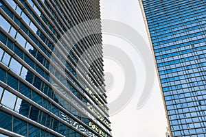 Glass office building exterior against the sky