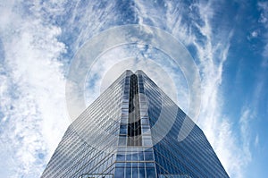 Glass Office Building In Huge Blue Sky