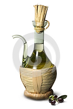 Glass oil cruet with straw and olives on white background
