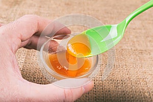 Glass of orange jelly made of Psyllium mucilage photo