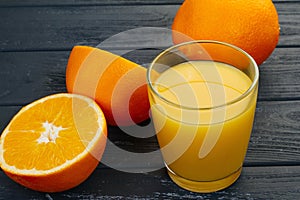 Glass of orange juice from above on wood table. Empty ready for your orange juice, fruit product display or montage