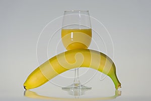 Glass of orange juice and banan photo