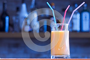 Glass of orange juice on bar counter