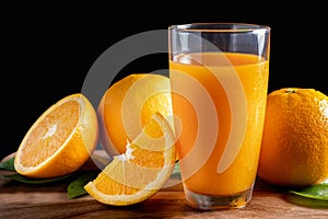 Glass of orange juice with fresh fruits