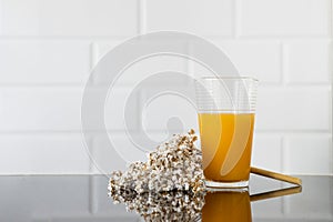 a glass of orange juice photo