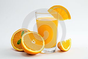 Glass of Orange Juice Next to Sliced Oranges