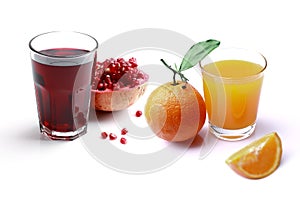 Glass of orange juice and pomegranate juice