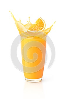 Glass of orange juice splash with orange sliced