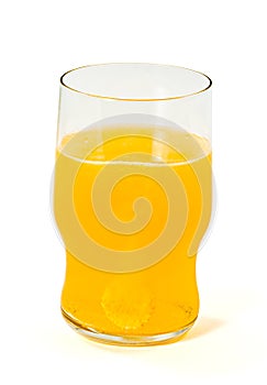 Glass with orange sparkling tablet