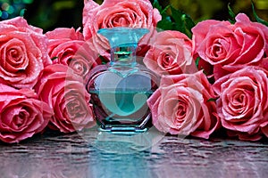 Glass perfume bottle smoke studio water drops flowers