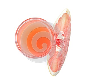 Glass of pink pomelo juice and fruit isolated on white, top view