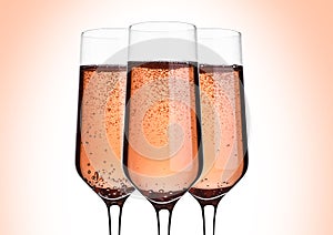 Glass of pink rose champagne with bubbles on pink