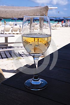 Glass of Pink or Rose Wine on a Table of a Beach Restaurant photo