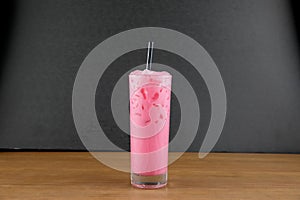 A glass of pink soda photo