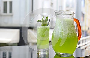 Glass and pitcher of fresh homemade lemonade