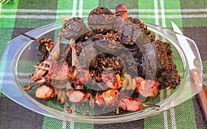 Glass platter with Meat and Barbecue Blood Sausage
