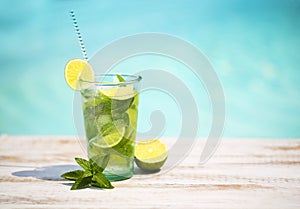 Glass at pool, beach side. Mojito photo