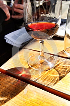 Glass of port wine tawny on a table