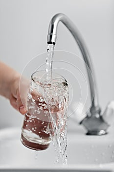 Glass pouring fresh drink water