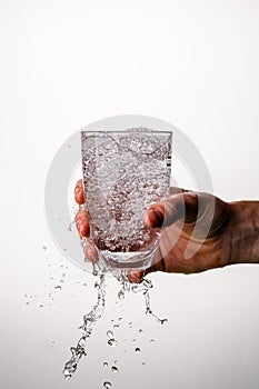 Glass with pouring water, bubbles