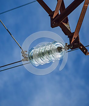 Glass prefabricated high insulators on poles high-voltage power lines. Electrical industry